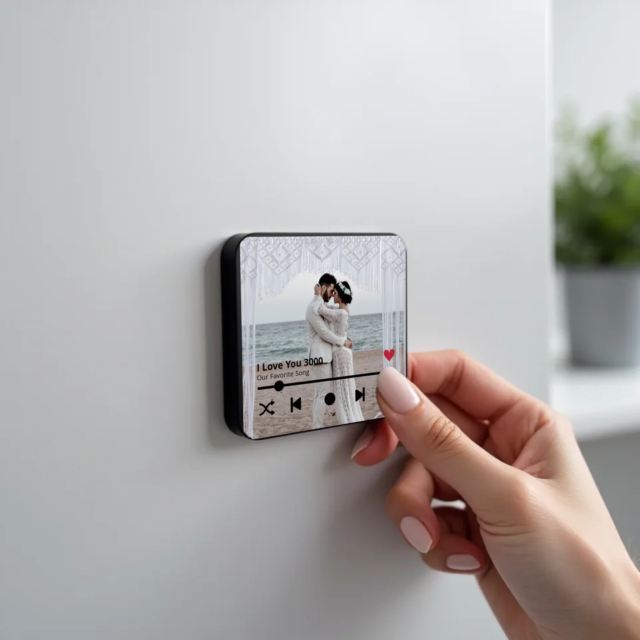 create_a_photorealistic_image_of_a_black_square_magnet_being_held_delicately_between_the_fingers_of_u5ld8if38hkpw8a2q0ny_1