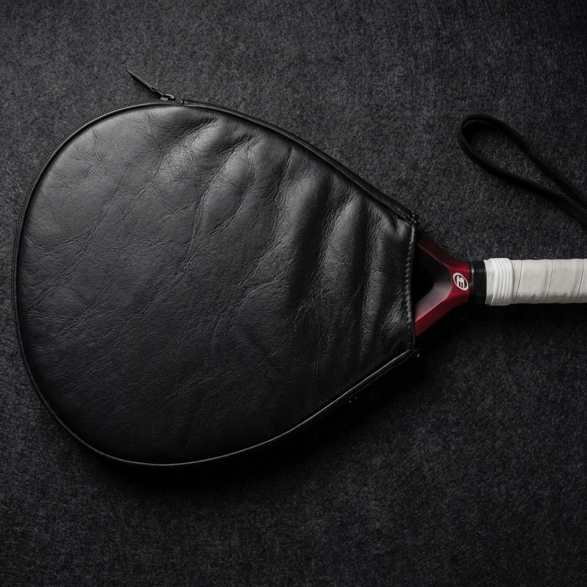 replace_the_background_with_a_premium_dark_black-grey_felt_surface_used_in_luxury_product_photograp_petga0q5u17rtiklbpsb