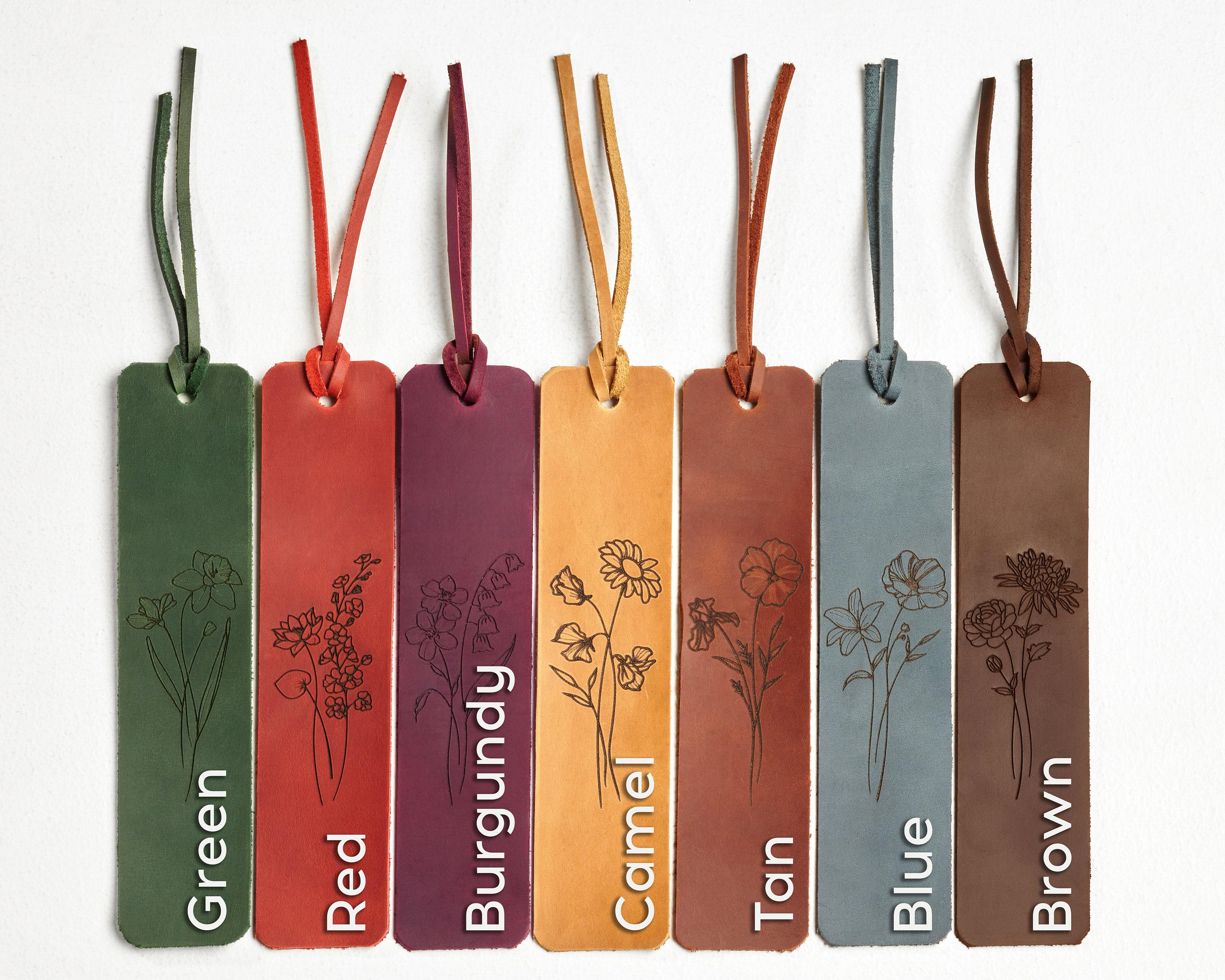 a row of different colored tags with flowers on them