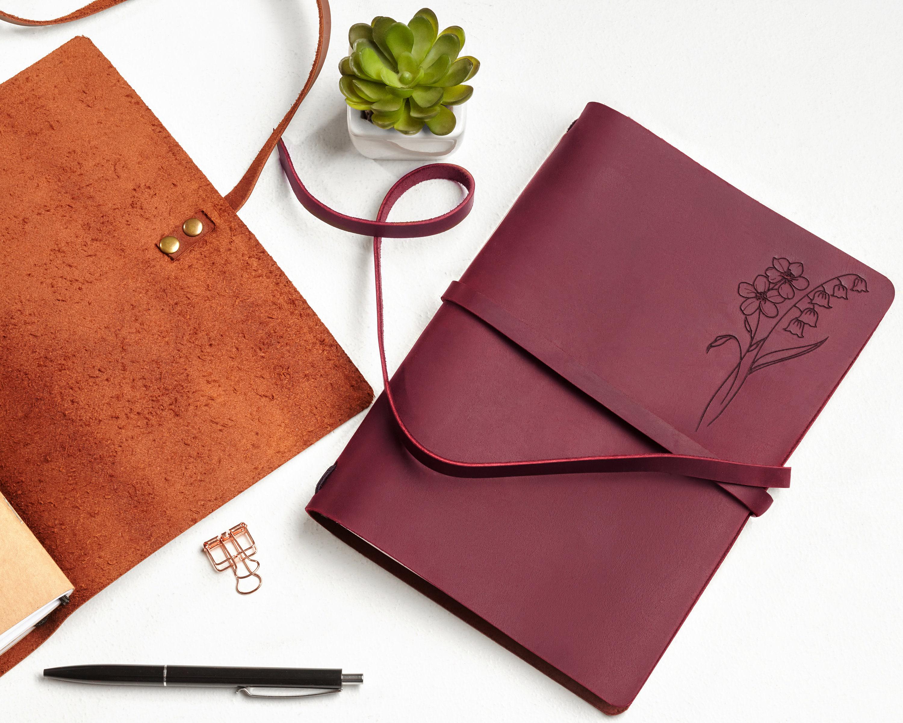 a notebook and a pen on a table