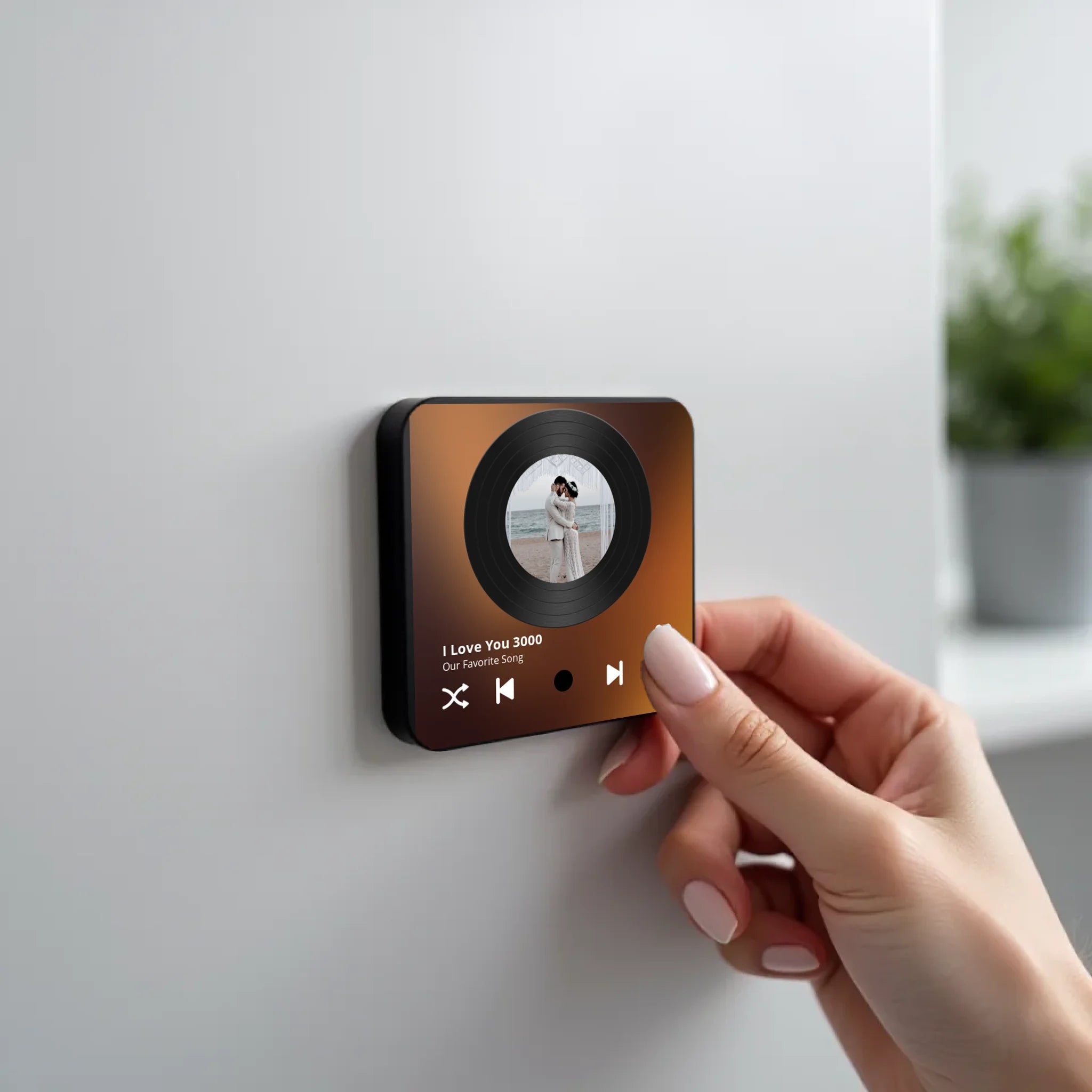 create_a_photorealistic_image_of_a_black_square_magnet_being_held_delicately_between_the_fingers_of_u5ld8if38hkpw8a2q0ny_1