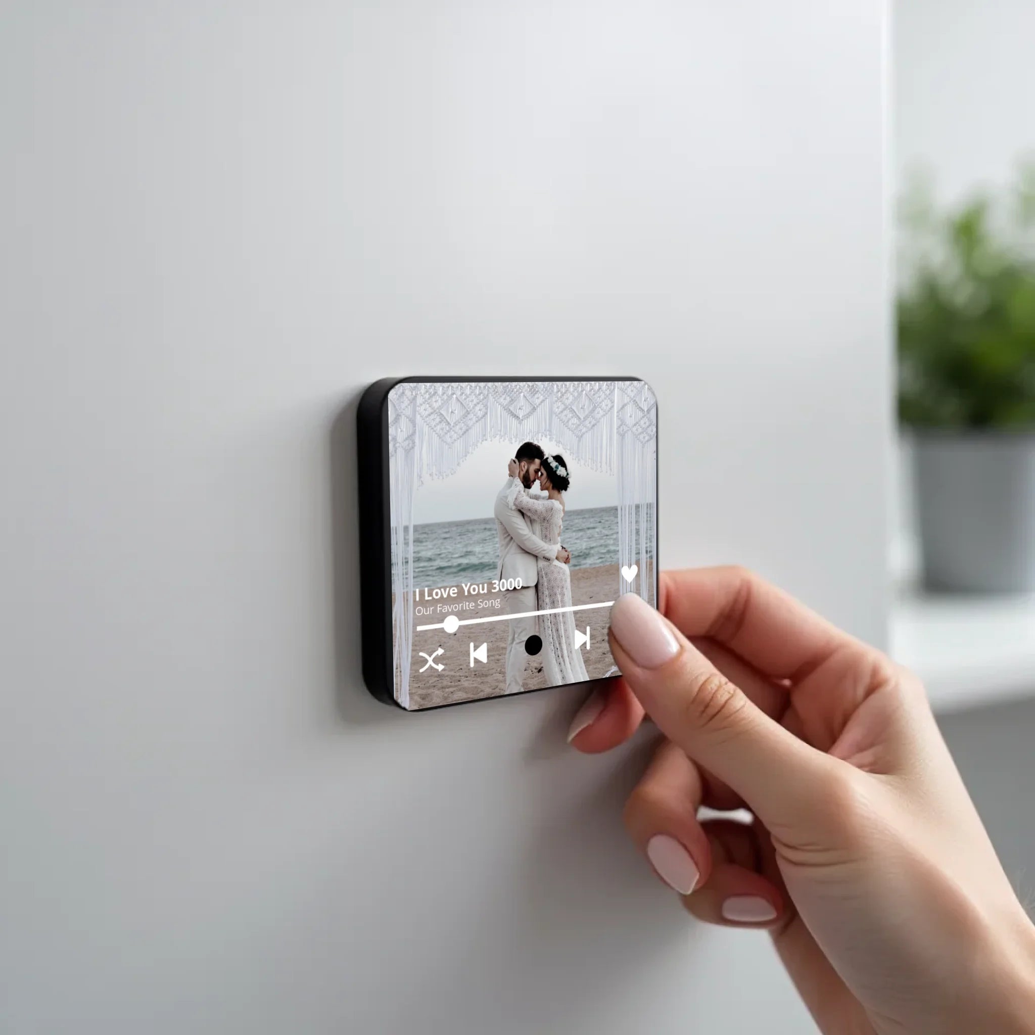 create_a_photorealistic_image_of_a_black_square_magnet_being_held_delicately_between_the_fingers_of_u5ld8if38hkpw8a2q0ny_1