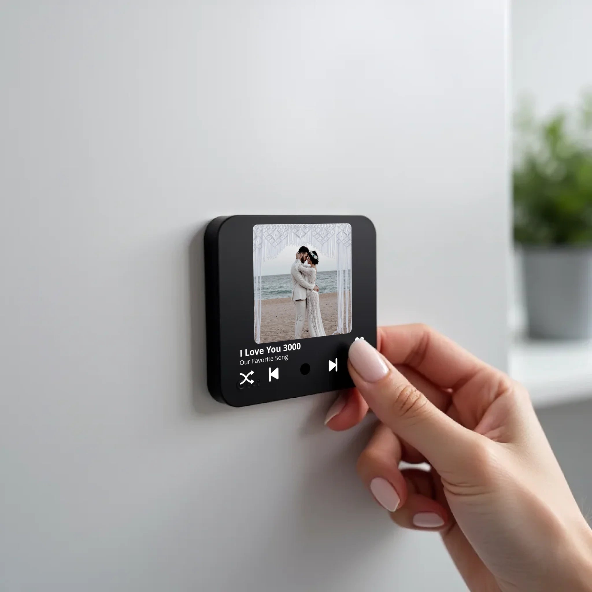 create_a_photorealistic_image_of_a_black_square_magnet_being_held_delicately_between_the_fingers_of_u5ld8if38hkpw8a2q0ny_1